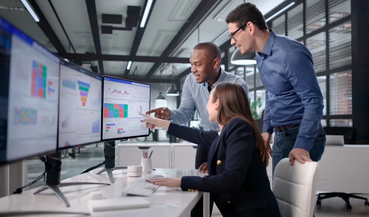 A team using a custom business dashboard in an office